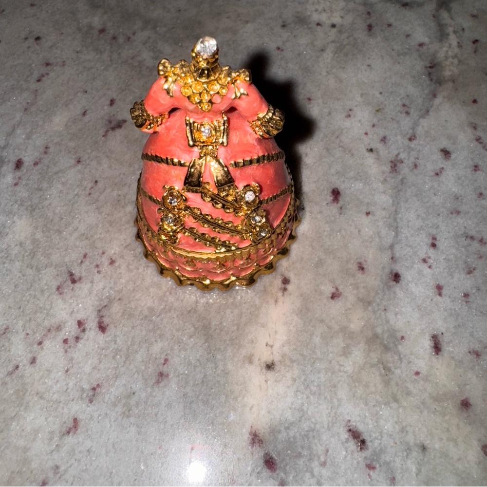 pink and gold Victorian dress with clear crystals in the front trinket